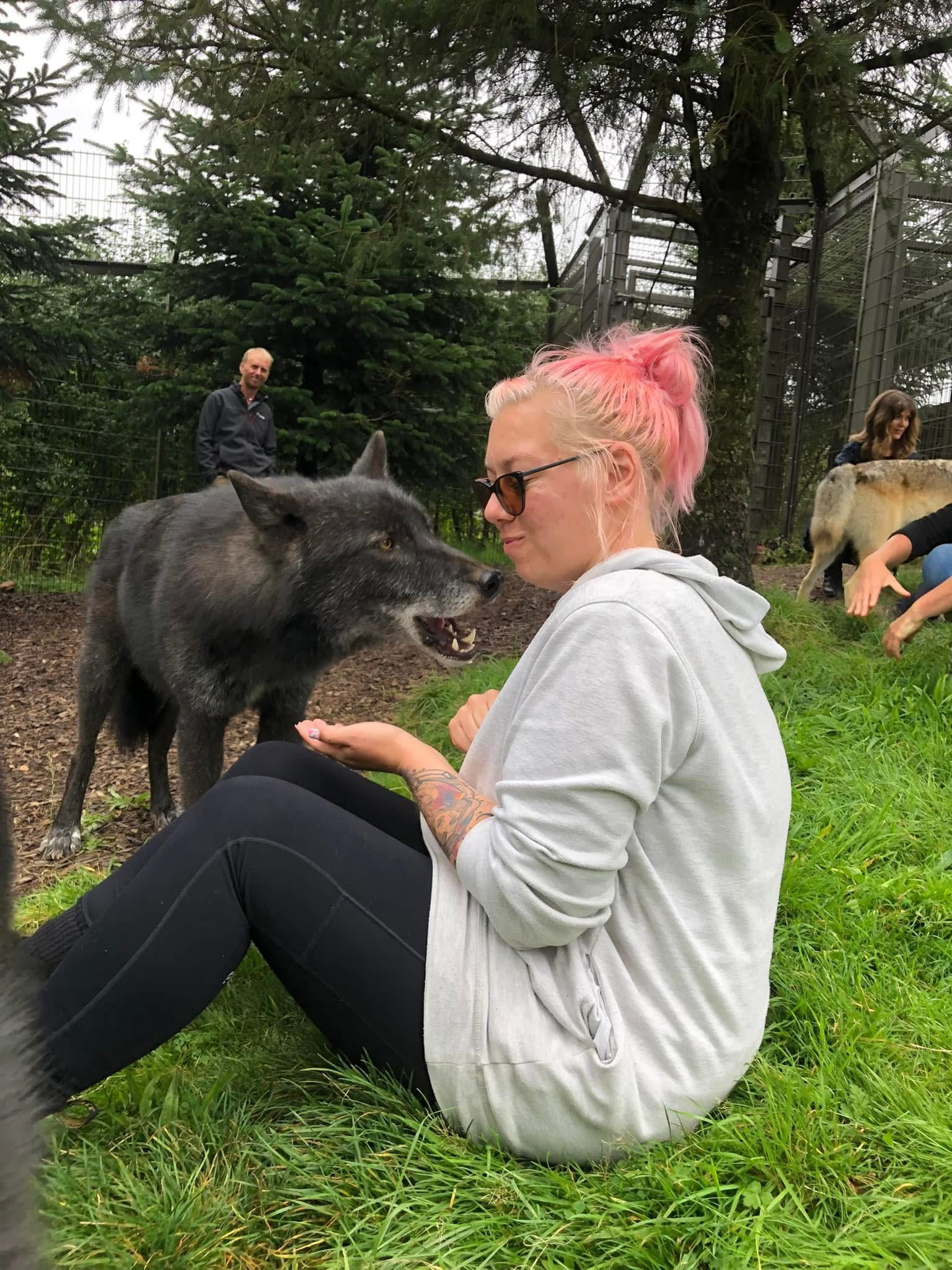 Jess with black dog at sanctuary